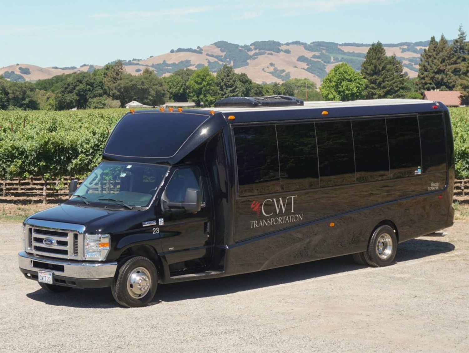 California Wine Tours Mercedes-Benz Sprinter van parked by vineyards, used for luxury corporate transportation in Napa Valley